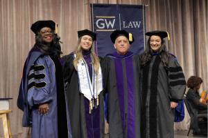 Dean Matthew, Gabriela Soto Cotto, Professor Benítez and Professor Vera, all smiling in their caps and gowns