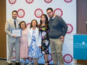 Alfredo De La Cruz stands with his family after being recognized by the Hispanic Bar Association Foundation