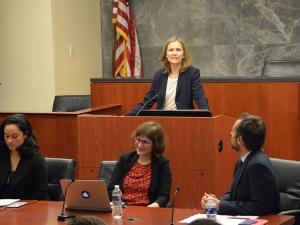 Francesca Bignami speaks behind a podium.