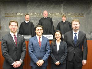 People stand together in the Moot Court Room