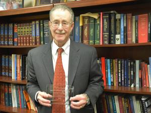 Professor Stephen A. Saltzburg poses with his Trial Lawyer Excellence Award.