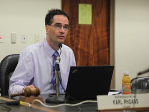 Representative Karl Rhoads (D-13) speaks at a committee hearing as Chair of the Judiciary Committee in the Hawaii State Senate.