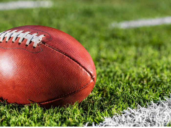 An American football on a field