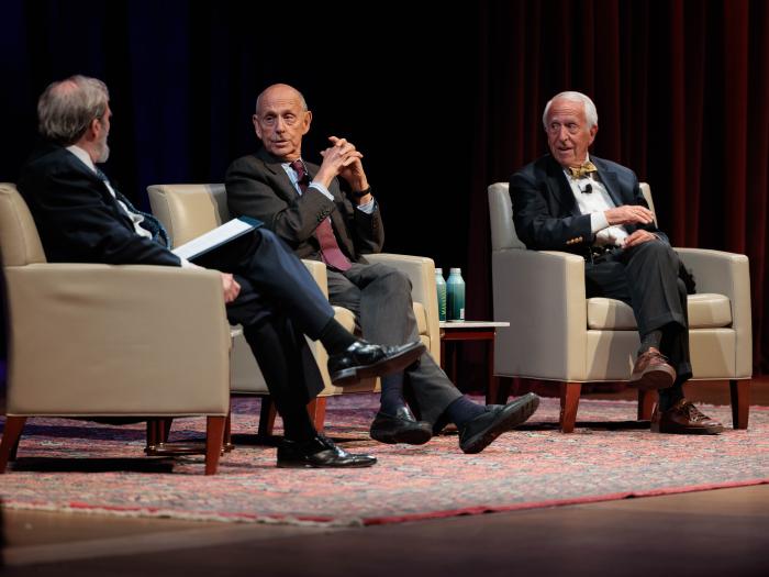 Dean Alan Morrison, Stephen Breyer, and Charles Breyer on stage talking