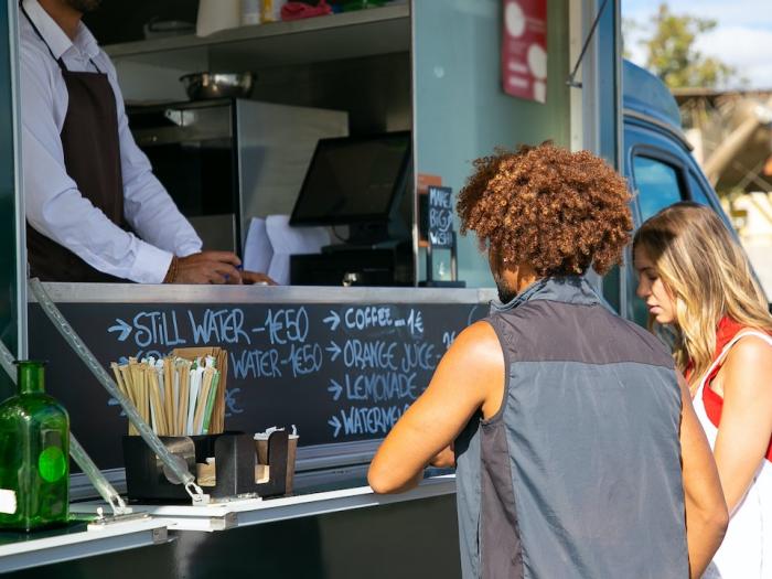 People ordering food at a food truck