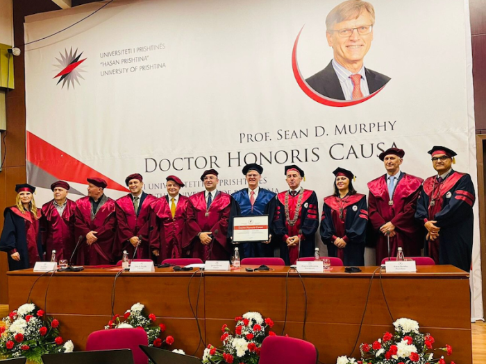 Professor Murphy holding his honorary degree with the Rector, Vice-Rectors, and Deans of the University of Prishtina