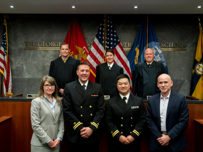 Appellate judges Captain Amanda Myers, Colonel Peter Houtz, and Captain Colin Kisor with the defendants and plaintiffs