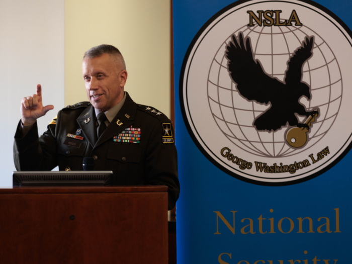 Lieutenant General Stuart W. Risch talking at a podium
