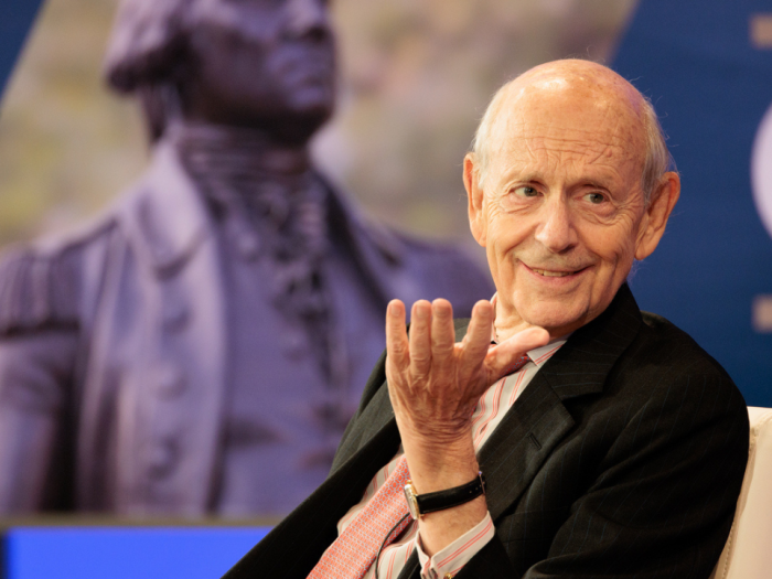 Retired U.S. Supreme Court Justice Stephen Breyer smiling while talking