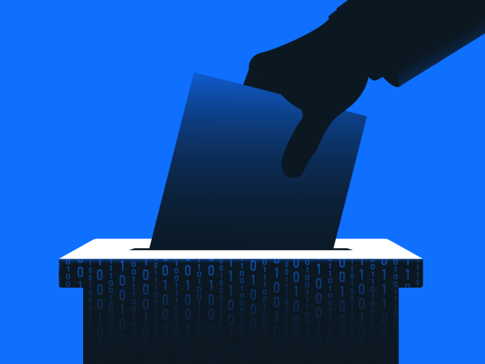 Hand putting ballot paper in a box with binary code.