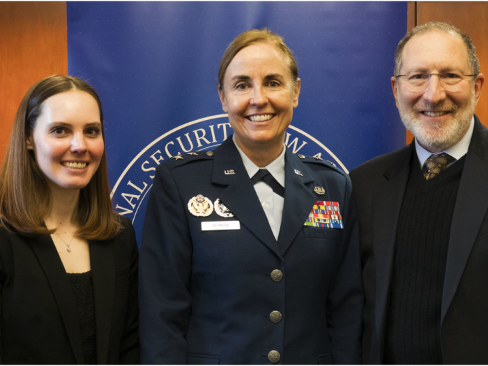 A student, Maj. Gen. Vernon, and Dean Schooner