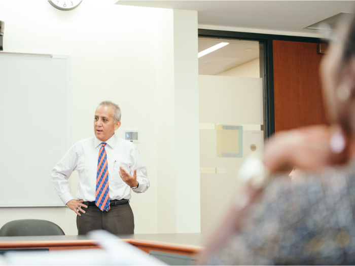 Professor Alberto Benitez teaching in a classroom