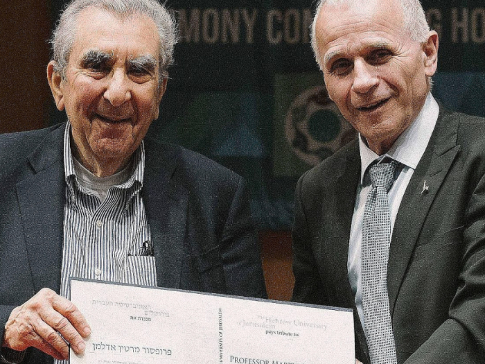 Martin J. Adelman (left) being presented an honorary fellowship diploma during the 87th Board of Governors meeting in Jerusalem