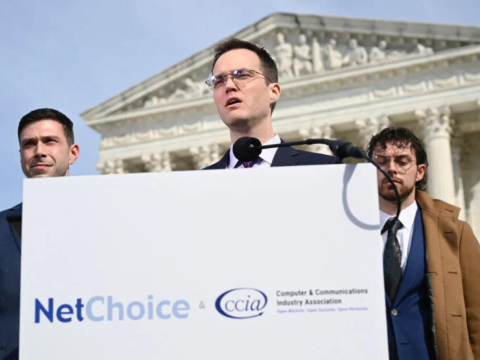 Chris Marchese (L), Director of NetChoice Litigation Center looks on as Matt Schruers (C), President and CEO of the Computer & Communications Industry Association (CCIA), speaks to reporters outside of the US Supreme Court