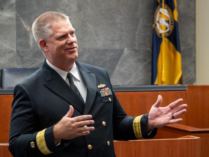 Navy Rear Admiral Jonathan Stephens talks to students during a GW Law event.