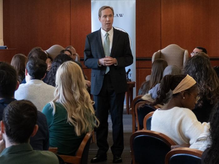 Chief Judge of the United States Court of Appeals for the Armed Forces Kevin A. Ohlson speaks to students during a Veterans Day event at GW Law.