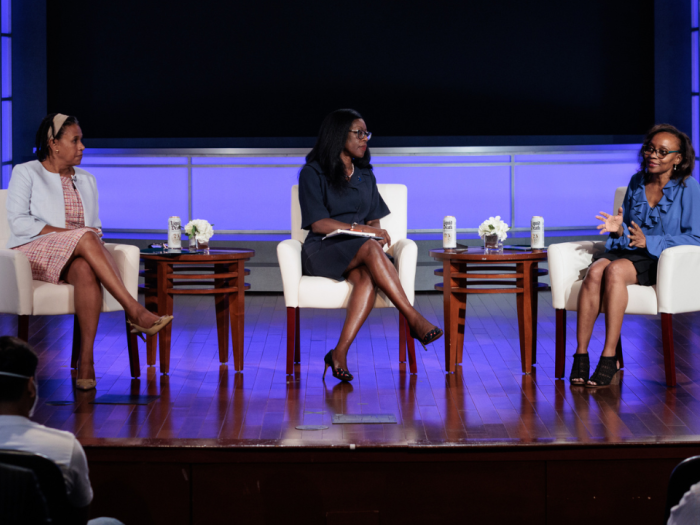 Dean Carmia N. Caesar, Dean Dayna Bowen Matthew, and Dr. Jennifer Eberhardt on stage talking