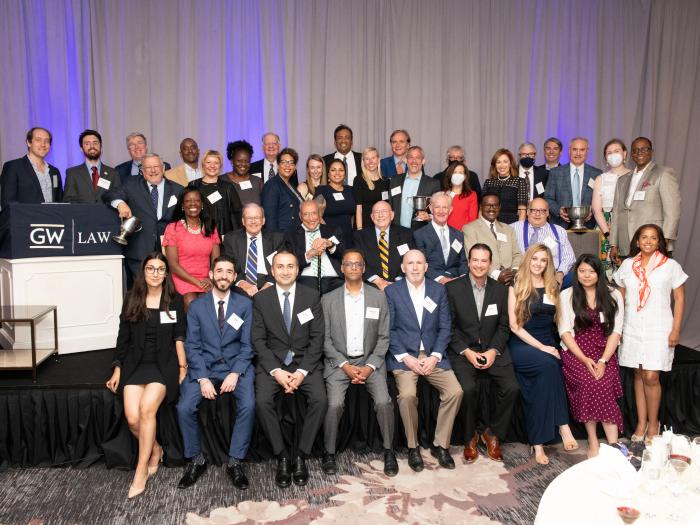 Law school alumni sitting on stage