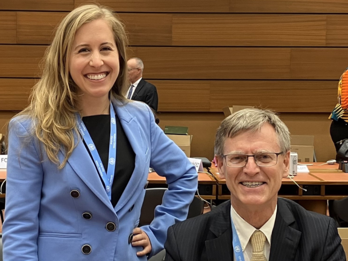 Jillian Timko standing and Sean D. Murphy sitting at the Geneva conference
