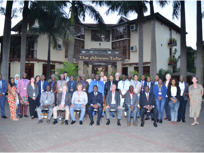 A group people in front of The African Tulip