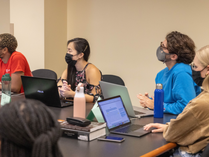 students in class with laptops