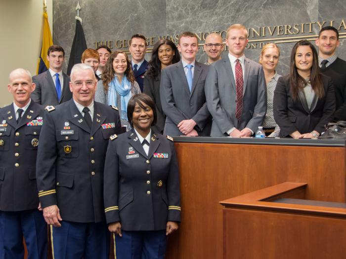 Photo of judges of the U.S. Army Court of Criminal Appeals with GW Law students.