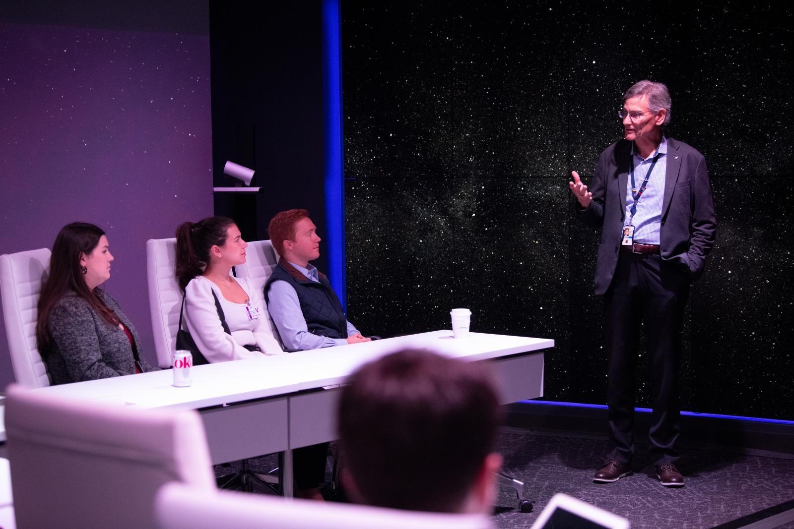 Students at Lockheed Martin listening to an instructor