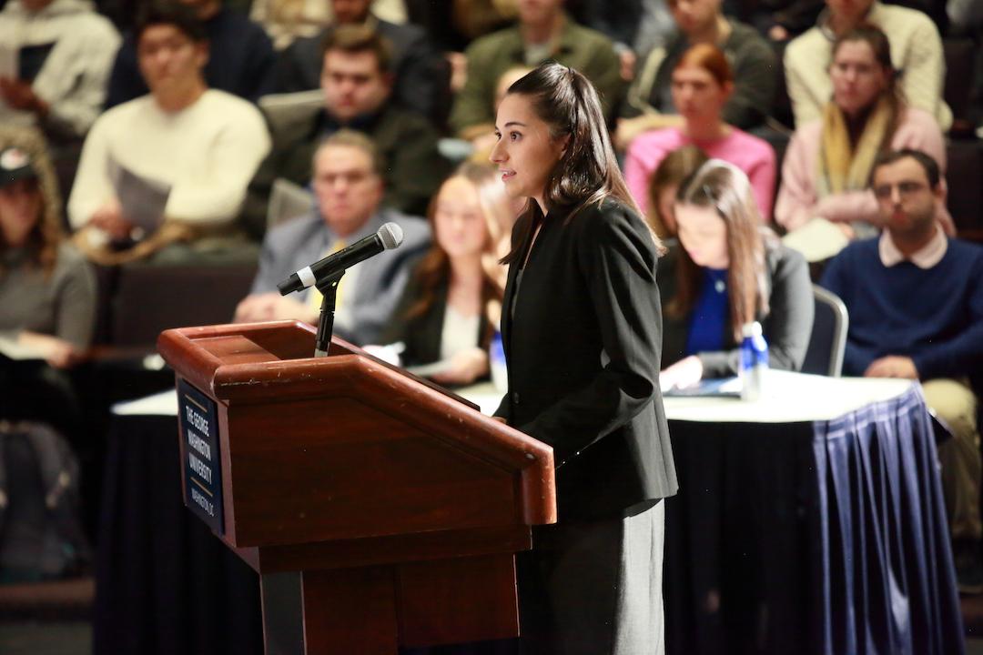 Lauren Arquette speaking at a podium