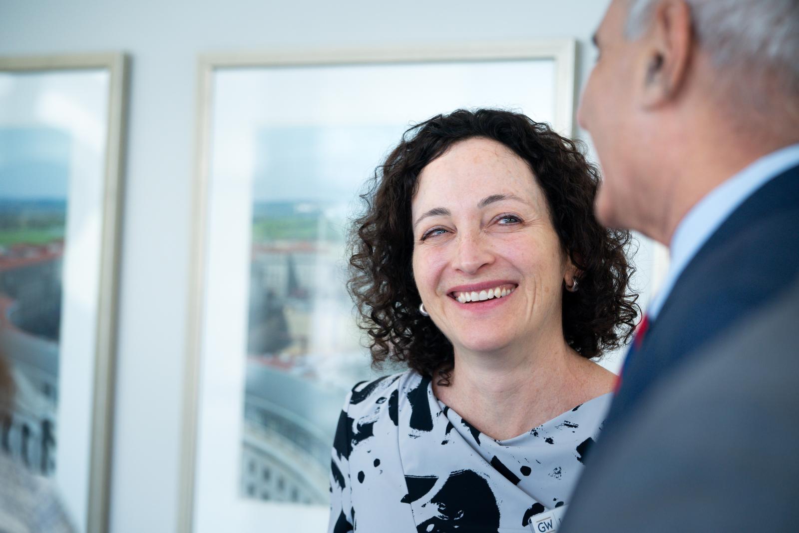 Professor Laura Richman smiling at a person