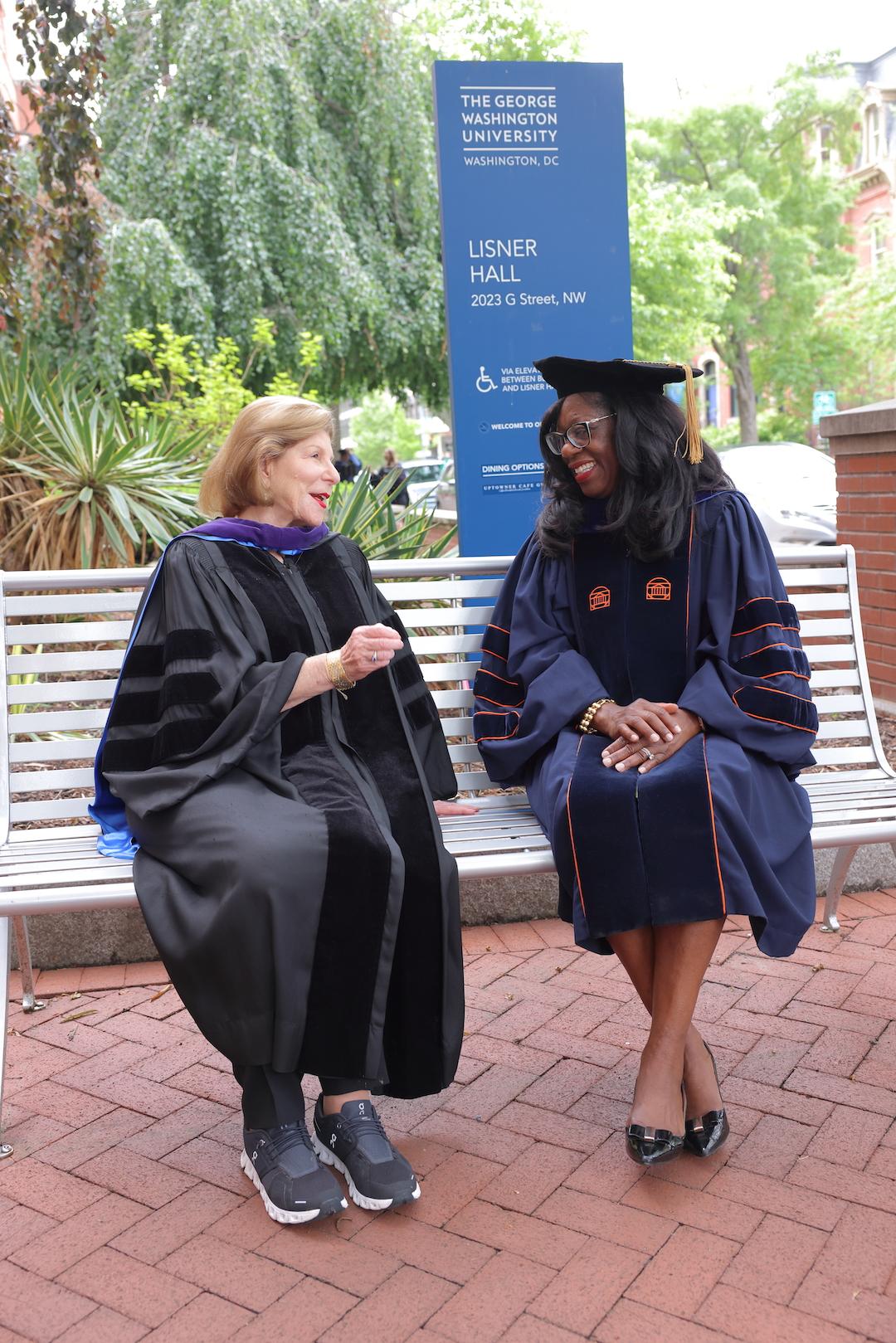Nina Totenberg and Dean Matthew talking on a bench