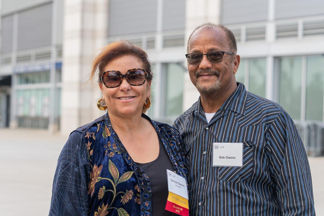 A GW Law alumni posing for a photo with her husband