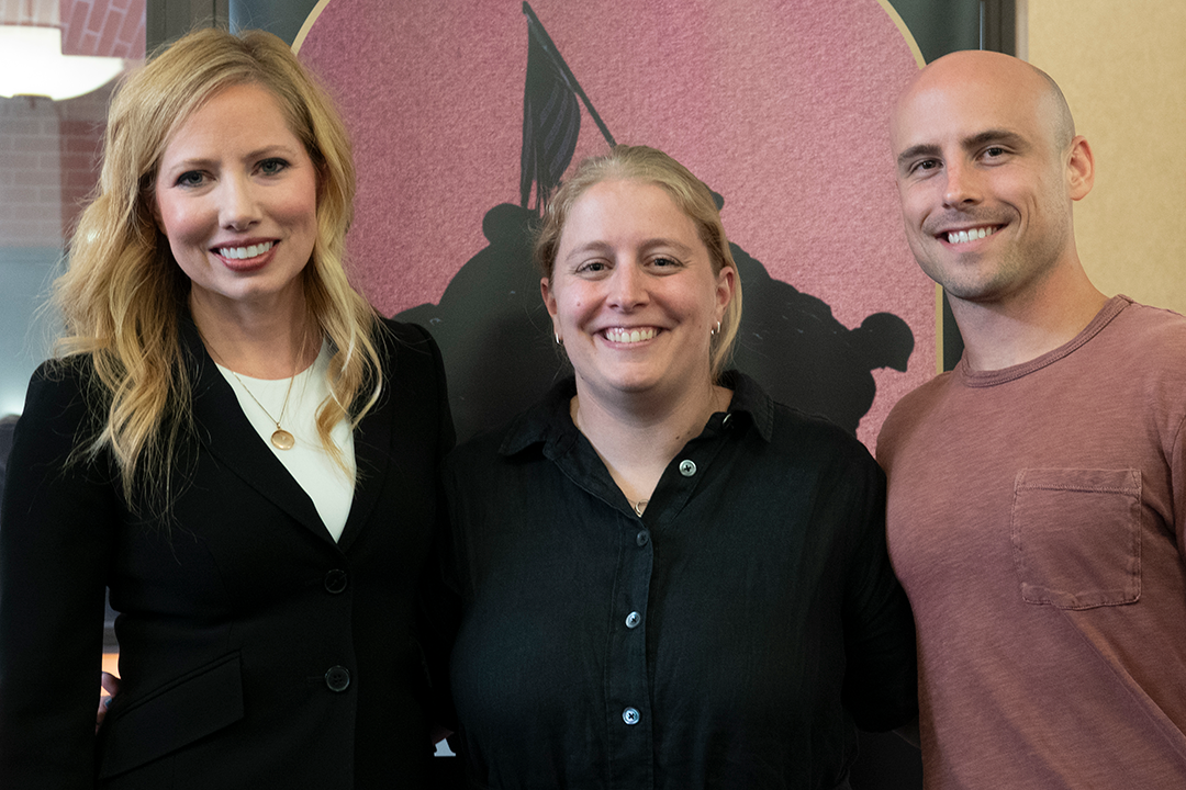 Tiffany M. Wagner with two event attendees.