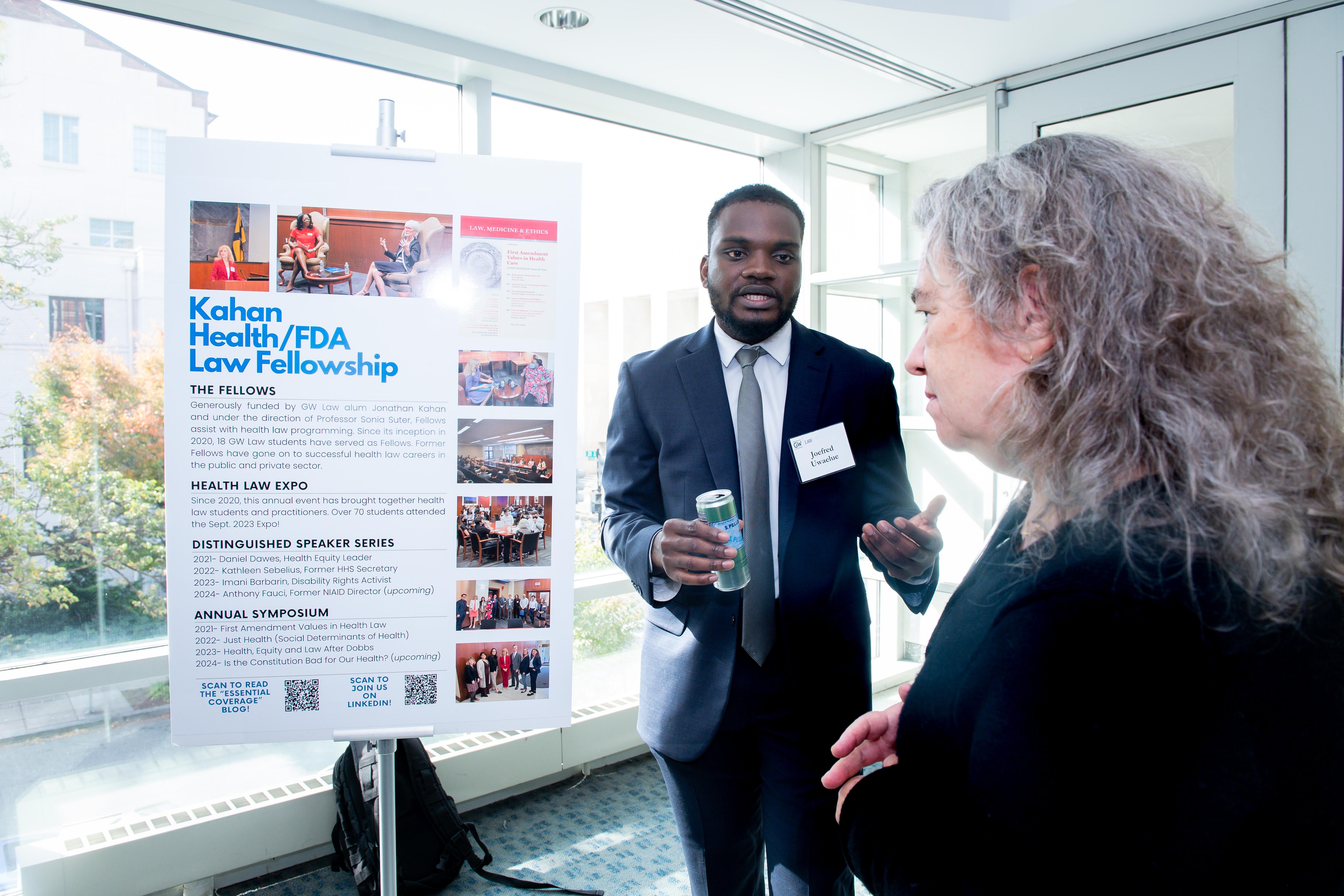 Joefred presenting to a woman about his fellowship