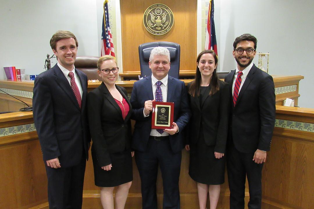 Alberto Estrella with the winners of the 2017 Estrella Trial Advocacy Competition.