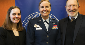 A student, Maj. Gen. Vernon, and Dean Schooner