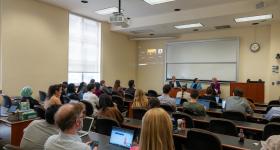 Attendees in front of the panel of speakers 