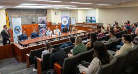GW Law students listen to a panel of speakers at the JAG Recruiter Panel in the Burns Moot Courtroom