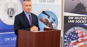 General Stuart Risch stands behind a podium during the veterans welcome back reception.